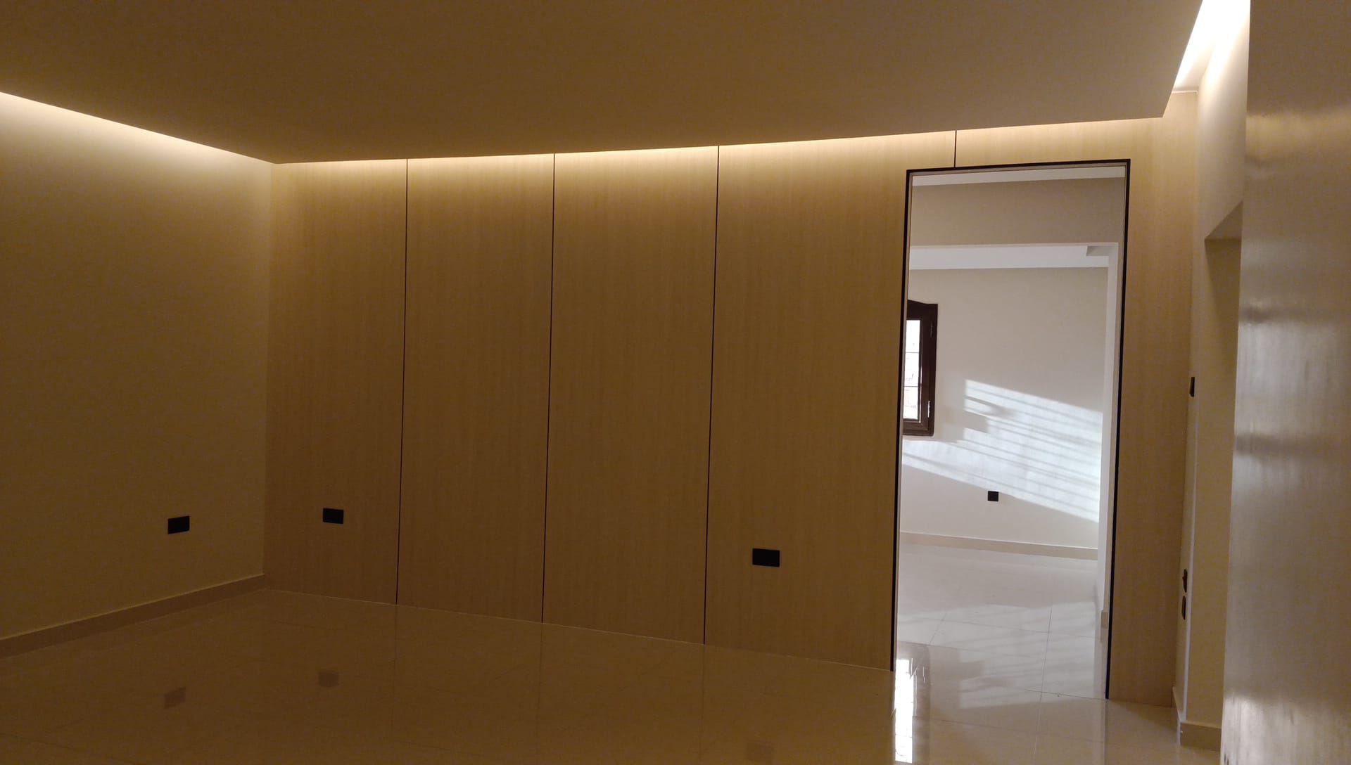 Built-in cabinetry integrated with gypsum wall detailing in a Doha interior (view 3)